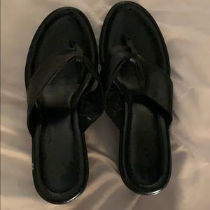 Black wedges, never worn.